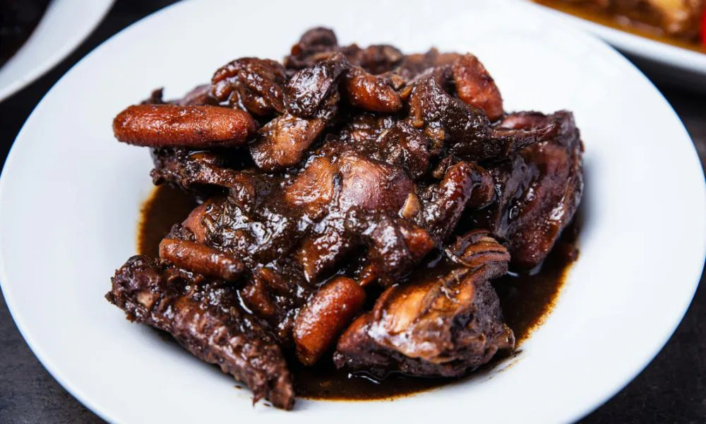 Braised chicken in dark soy sauce with tender meat and savory sauce at Canto House, a Chinese restaurant in Philadelphia